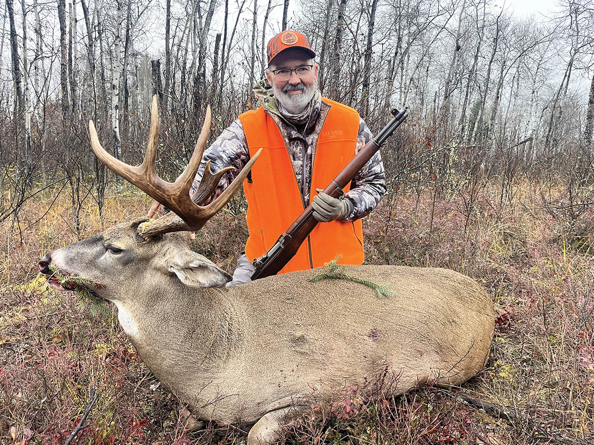 The author with a nice whitetail deer taken with his trusty M1 Garand.